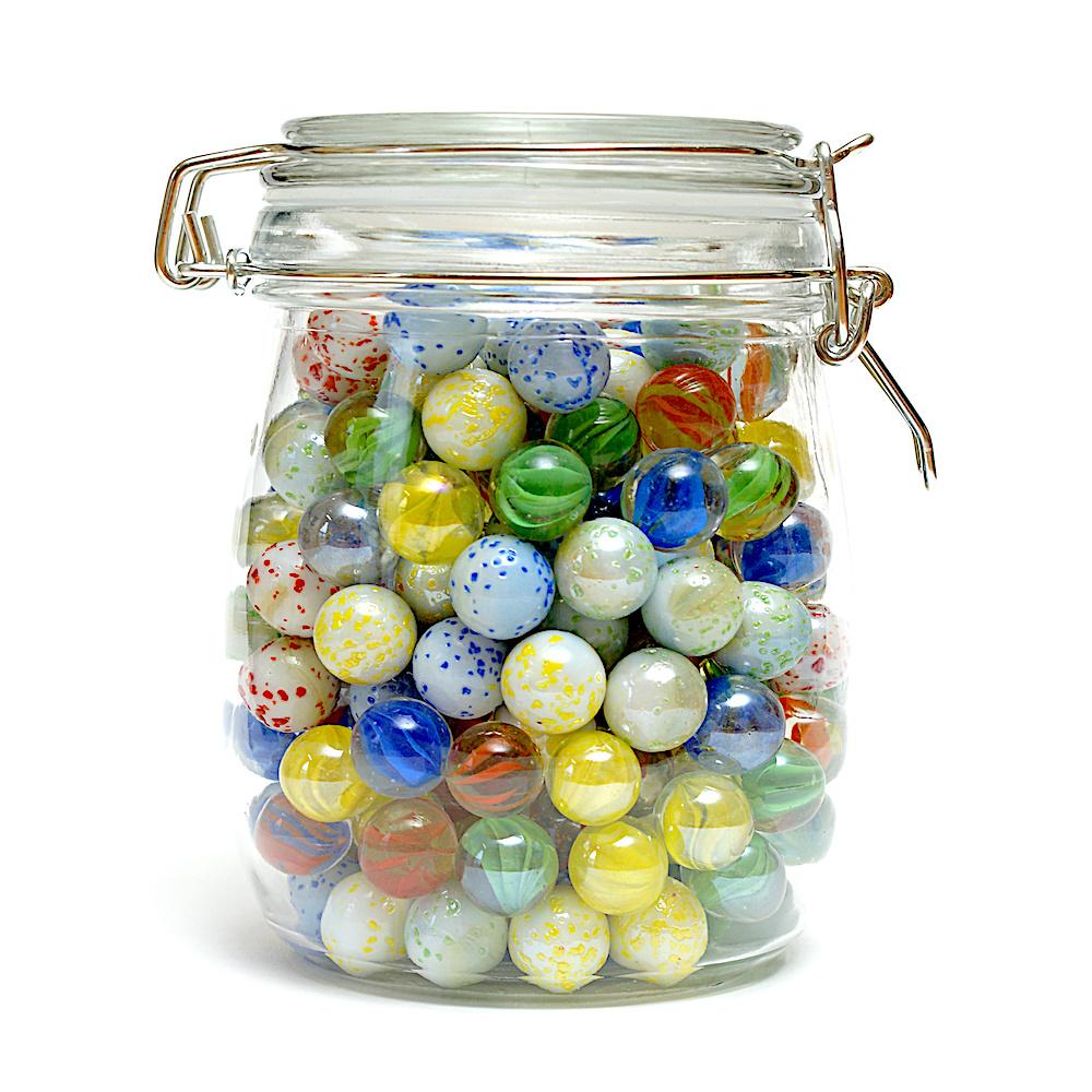 Glass jar filled with colorful marbles